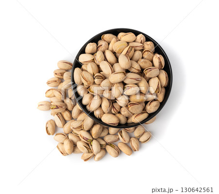 Fried salt pistachio nuts isolated. Baked pistachios pile, roasted green pistache fruit in shell on white 130642561