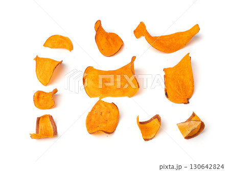 Dry sweet potato chips isolated, dried sliced red vegetable, healthy crispy snack flakes pile Dry sweet potato chips isolated, dried sliced red vegetable, healthy crispy snack flakes pile 130642824