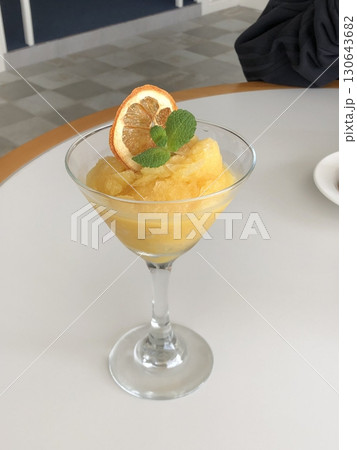 Zesty orange slushies made with juicy citrus and crushed ice, offering a perfect burst of sweet, tangy flavor and icy refreshment in every bright and revitalizing sip. 130643682