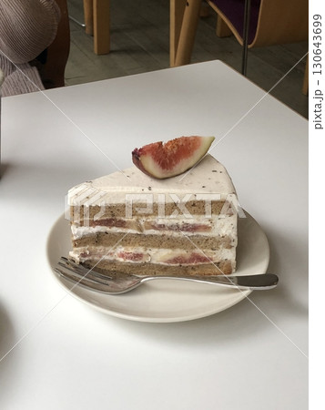 Light and fluffy fig shortcake slice with soft sponge layers, fresh fig slices, and creamy whipped filling. A perfect balance of natural sweetness and delicate texture for a delightful dessert. 130643699