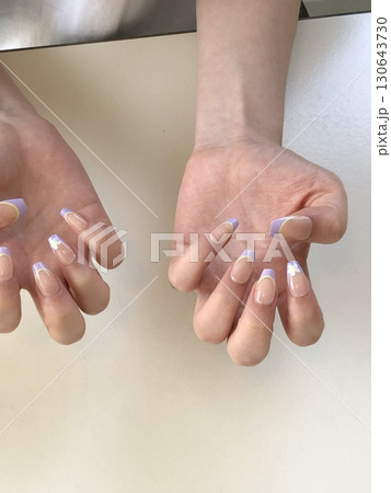 Creative nail art featuring intricate designs, vibrant colors, and unique patterns. Perfect for beauty and fashion photography, showcasing trends in nail designs and the artistry of manicure. 130643730