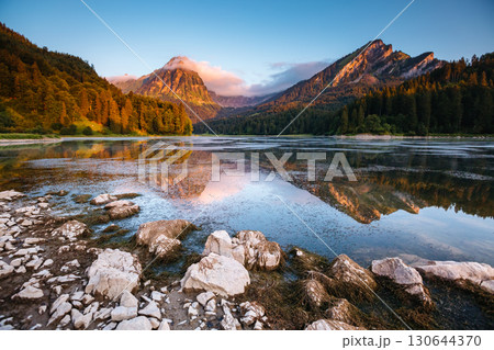 Great view of the azure pond Obersee glowing by sunlight. Location Nafels, Swiss alps, Europe. 130644370