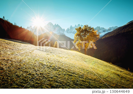 View of the alpine hill that glowing by sunlight. Location Funes valley, Dolomites. South Tyrol. Italy, Europe. View of the alpine hill that glowing by sunlight. Location Funes valley, Dolomites. South Tyrol. Italy, Europe. 130644649