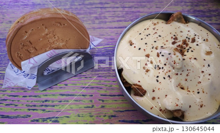 Traditional Korean dessert and savory dish served on a colorful wooden table 130645044