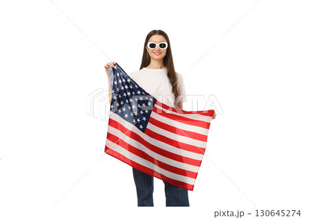 Woman proudly waves American flag joyfully, isolated on white, PNG Woman proudly waves American flag joyfully, isolated on white, PNG 130645274