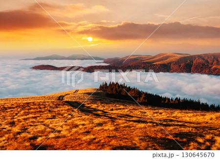 Breathtaking morning moment in alpine foggy valley. Breathtaking morning moment in alpine foggy valley. 130645670
