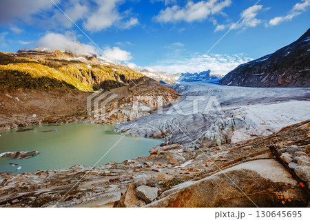 Great sunny day in the Alpine valley. Location place of Bernese Alps, Rhone glacier, Swiss alps. Great sunny day in the Alpine valley. Location place of Bernese Alps, Rhone glacier, Swiss alps. 130645695