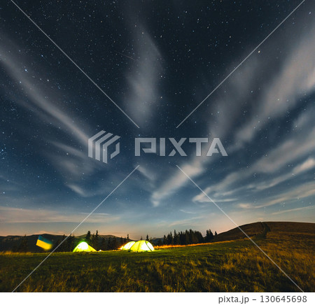 Scenic image of the night sky above the campsite. Scenic image of the night sky above the campsite. 130645698