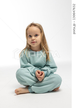Portrait of beautiful cute little toddler girl. Child with funny face. Pretty smile kid in studio on white background. High quality photo Portrait of beautiful cute little toddler girl. Child with funny face. Pretty smile kid in studio on white background. High quality photo 130647632