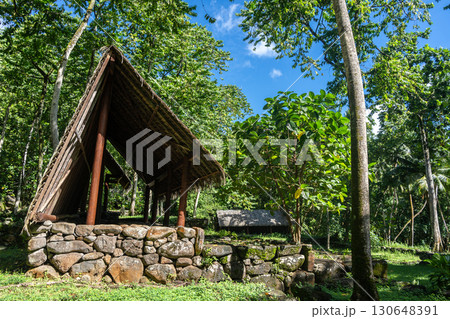 Thatched-roof building at Kamuihei archaeological site, Nuku Hiva, Marquesas Islands. French Polynesia 130648391