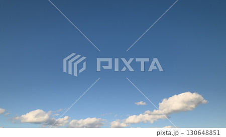A beautiful serene blue sky filled with fluffy white clouds for everyone to appreciate today A beautiful serene blue sky filled with fluffy white clouds for everyone to appreciate today 130648851