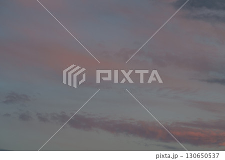 Experience the Serene Evening Sky with its Soft Pastel Hues as Day Transitions to Dusk Experience the Serene Evening Sky with its Soft Pastel Hues as Day Transitions to Dusk 130650537