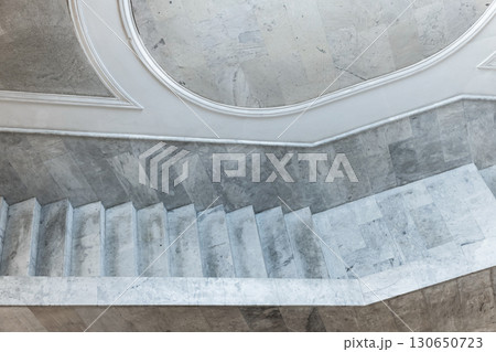 Blue toned tilt view of a marble staircase showcasing minimalist architecture Blue toned tilt view of a marble staircase showcasing minimalist architecture 130650723