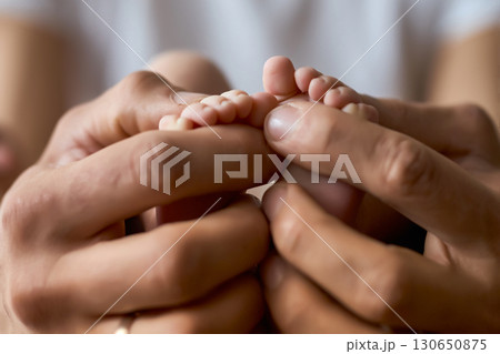 Newborn Baby Feet in Parent's Hands Newborn Baby Feet in Parent's Hands 130650875