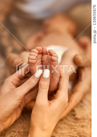 Newborn Baby Feet in Parent's Hands Newborn Baby Feet in Parent's Hands 130650876