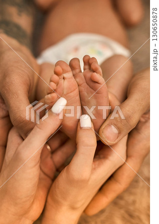 Newborn Baby Feet in Parent's Hands Newborn Baby Feet in Parent's Hands 130650878