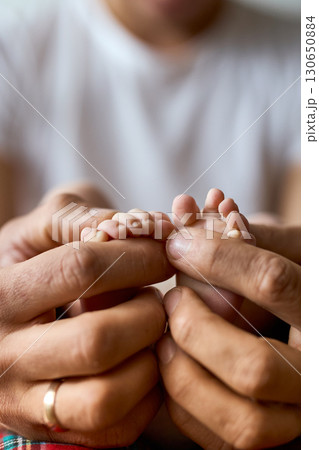 Newborn Baby Feet in Parent's Hands Newborn Baby Feet in Parent's Hands 130650884