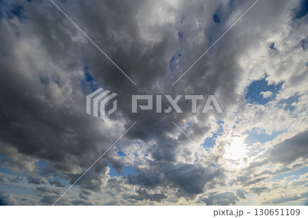 Witness the breathtaking beauty of a dramatic sky filled with clouds and radiant sunlight Witness the breathtaking beauty of a dramatic sky filled with clouds and radiant sunlight 130651109