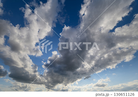 A Dramatic and Striking Cloud Formation Posed Against the Beautiful Blue Sky Above Us A Dramatic and Striking Cloud Formation Posed Against the Beautiful Blue Sky Above Us 130651126