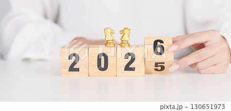 Happy New Year 2025 change to 2026 year block with horse chess. Year of the Horse, animals of the Chinese zodiac, horoscope, success and good fortune Happy New Year 2025 change to 2026 year block with horse chess. Year of the Horse, animals of the Chinese zodiac, horoscope, success and good fortune 130651973
