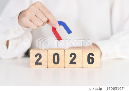 hand holding magnet over 2026 Year block. Human resource management, Recruitment, Teamwork, strategy, toxic people and leadership Concepts 130651974