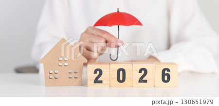 Happy New Year 2026 with red umbrella over money stack. Insurance, real estate, Home loan, tax, investment, mortgage, financial, savings, protection and safety Happy New Year 2026 with red umbrella over money stack. Insurance, real estate, Home loan, tax, investment, mortgage, financial, savings, protection and safety 130651979