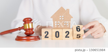 2025 end year to Happy New Year 2026 with small toy house model with gavel justice hammer on desk in courthouse. Real Estate Law, Home Insurance, property Tax, Auction and Bidding concepts 2025 end year to Happy New Year 2026 with small toy house model with gavel justice hammer on desk in courthouse. Real Estate Law, Home Insurance, property Tax, Auction and Bidding concepts 130651984