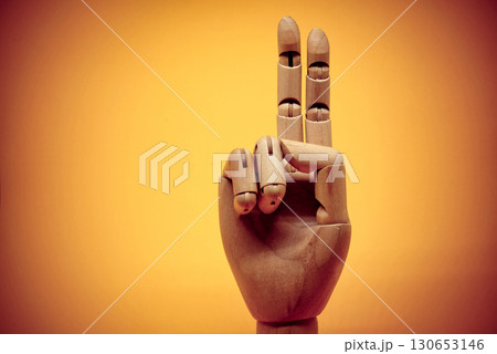 Wooden hand pointing up 2 fingers Wooden hand pointing up 2 fingers 130653146