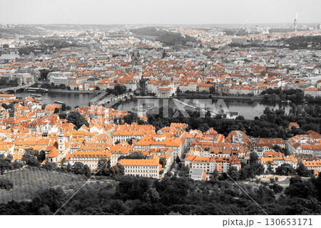 Beautiful aerial view of Prague's cityscape, showcasing the iconic roofs and historic bridges spanning the Vltava river 130653171