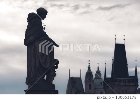Statue of St. Nicholas of Tolentino stands on the Charles Bridge, Czech Republic 130653178