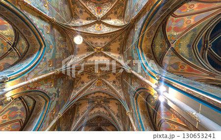 Ornate ceiling with religious art illuminating Basilica of Sts Peter and Paul in Prague, Czech Republic 130653241