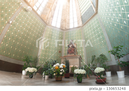 Emmaus Monastery: octagonal dome and saint statue adorned with flowers and plants. Prague, Czech Republic 130653248