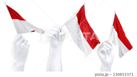 Hands waving flag of Indonesia isolated on white. 3d Rendering 130653371