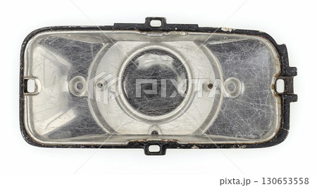 Scratched light cover isolated on white background,old transparent lens,top view,scuffed surfac e 130653558