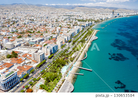 Limassol cityscape with palm trees lining the coastline on a sunny day. Cyprus 130653584