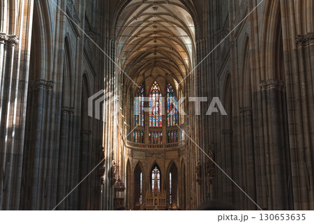 Sunlight streaming through stained glass windows in gothic St. Vitus Cathedral. Prague, Czech Republic 130653635