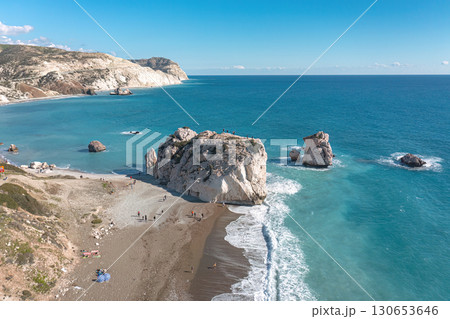 Tourists enjoying a sunny day at Aphrodite's Rock beach in Cyprus Tourists enjoying a sunny day at Aphrodite's Rock beach in Cyprus 130653646