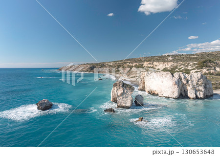 Turquoise mediterranean sea gently lapping the beautiful white rocks of aphrodite's birthplace in cyprus 130653648
