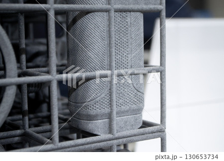 Object printed on 3D printer from molten plastic powder close-up. Model printed on 3D printer from melted polyamide powder. New modern additive 3D printing technology. Multi Jet Fusion MJF technology 130653734