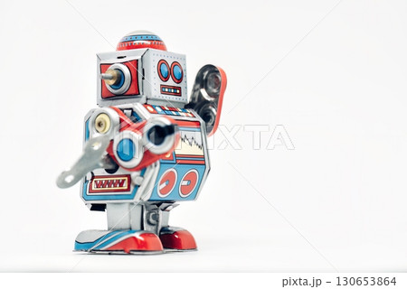 Classic toy robot standing and waving on white background Classic toy robot standing and waving on white background 130653864