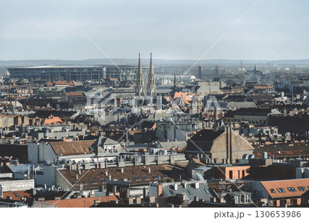 Budapest cityscape with church steeple rising above rooftops Budapest cityscape with church steeple rising above rooftops 130653986