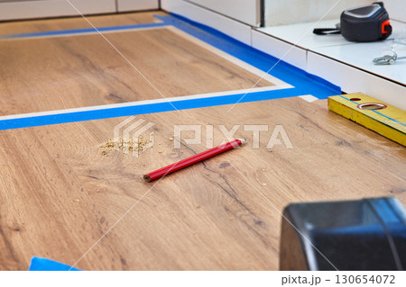 Carpenter's pencil lying on kitchen countertops, marking cutting hole for the sink Carpenter's pencil lying on kitchen countertops, marking cutting hole for the sink 130654072