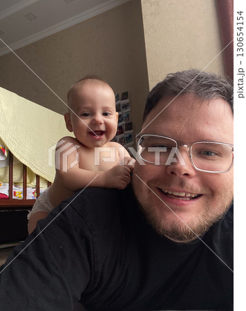 Playful Bonding Time with Baby and Dad 130654154
