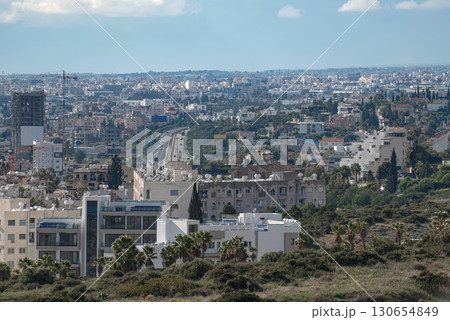 Highway cutting through dense Limassol cityscape in the daytime. Cyprus Highway cutting through dense Limassol cityscape in the daytime. Cyprus 130654849