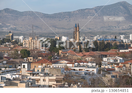 Selimiye Mosque dominating skyline of Nicosia, Cyprus with Turkish and TRNC flags on Kyrenia mountain range Selimiye Mosque dominating skyline of Nicosia, Cyprus with Turkish and TRNC flags on Kyrenia mountain range 130654851