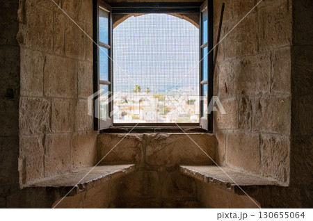 Window showing cityscape from Kolossi castle interior. Limassol District, Cyprus 130655064
