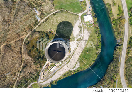 Aerial view, directly above of an abandoned thermal power plant cooling tower. 130655850