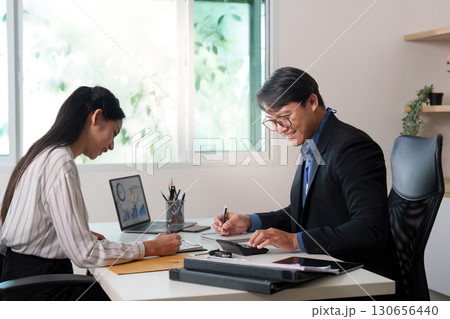 Car Dealership. A friendly consultation between a client and a salesperson. 130656440