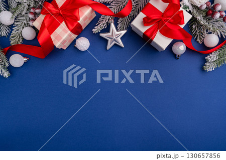 Christmas Gift Boxes with Red Ribbons and Snowflakes Christmas Gift Boxes with Red Ribbons and Snowflakes 130657856