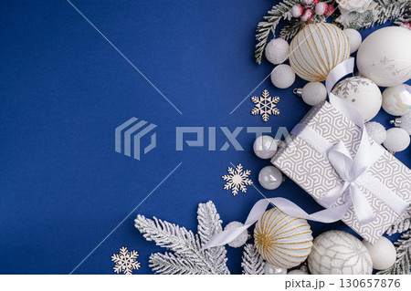 Silver New Year Decor with White Ornaments and Gift Silver New Year Decor with White Ornaments and Gift 130657876